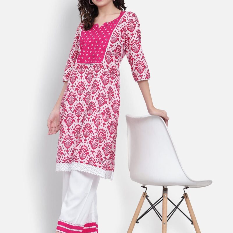 Pink printed kurta set styled with modern dhoti pants and heels.